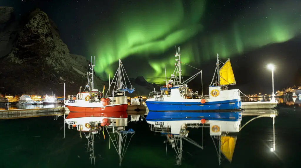 Fishing boats under the northern lights, Lofoten