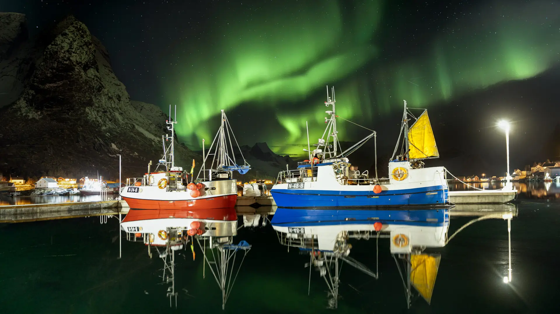 Fishing boats under the northern lights, Lofoten