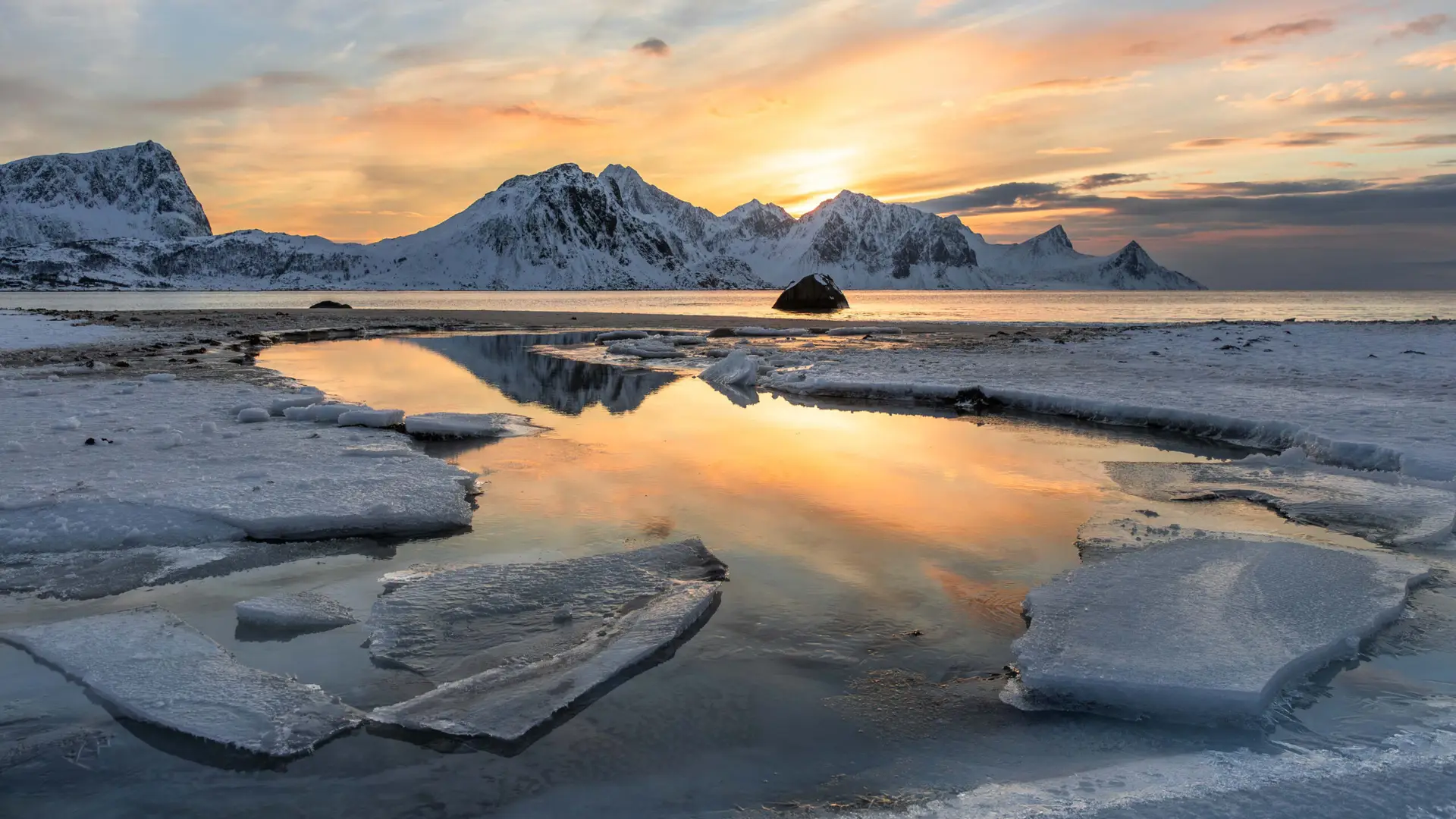 Sunset over ice and sea in Lofoten